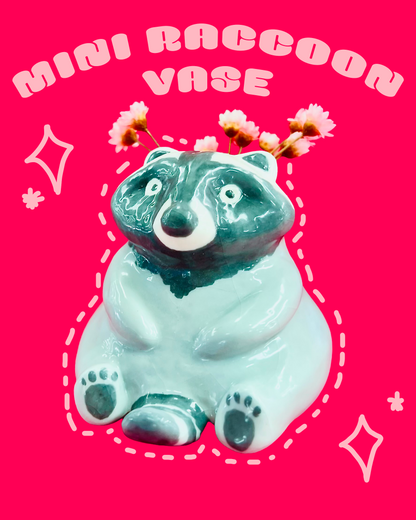 Miniature raccoon-shaped vase on a pink background with decorative elements.