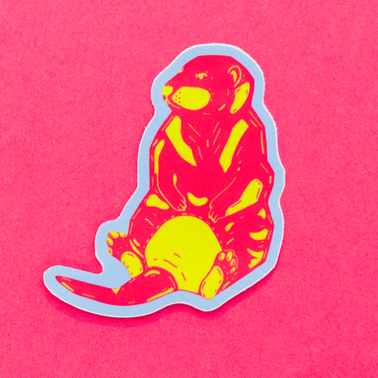 Sticker of a pink and green otter with pale blue border. Bright pink backdrop.