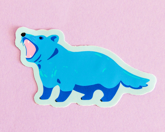 Blue illustration of a tasmanian devil sticker on a light purple background