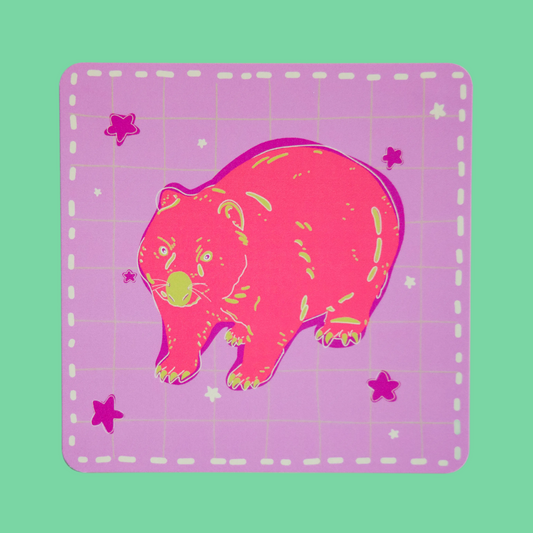 Bright and colourful illustration print of a pink wombat with green markings on a background of light purple and light green checkered lines. Dark purple and light green stars are sprinkled around the background. A thick pill dotted line borders the square print. The print is framed by a light green background.